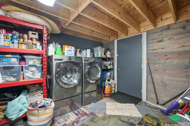 clothes washing area with washing machine and clothes dryer