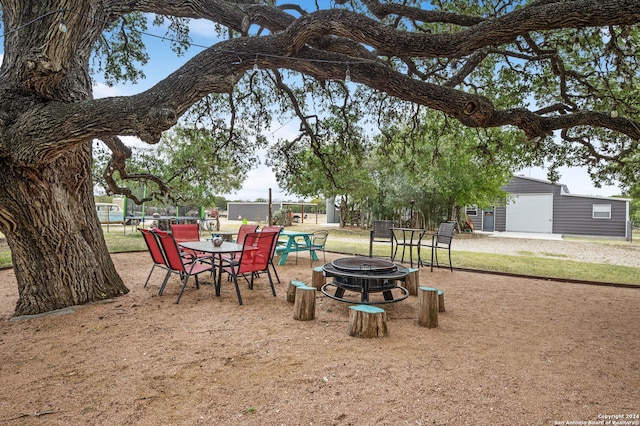 view of yard with a patio and a fire pit