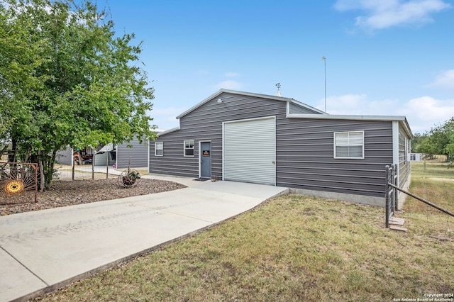 exterior space with a lawn and a garage