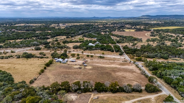 drone / aerial view featuring a mountain view and a rural view