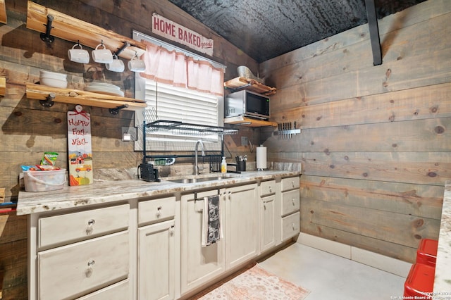 kitchen with wooden walls and sink