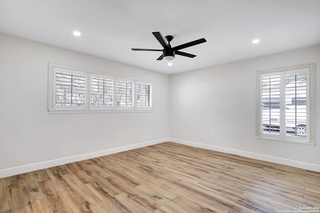 spare room with ceiling fan and light hardwood / wood-style flooring