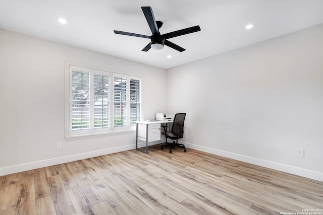 unfurnished office featuring ceiling fan and light hardwood / wood-style floors