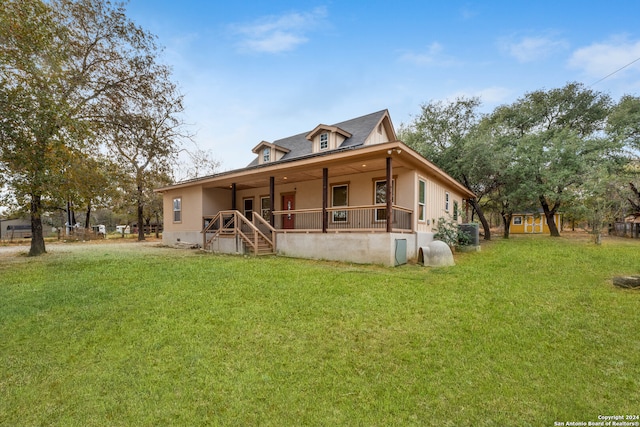 exterior space with a porch and a lawn