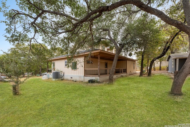 view of property exterior featuring a lawn and cooling unit