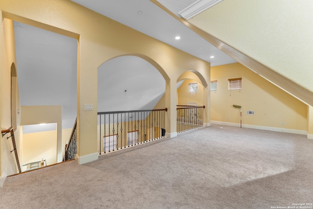 bonus room featuring carpet and lofted ceiling