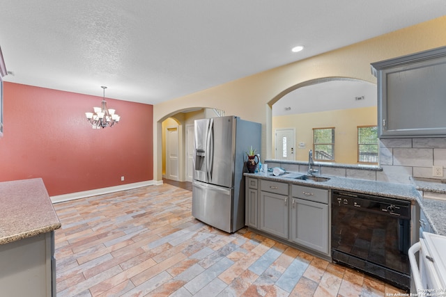 kitchen with hanging light fixtures, dishwasher, gray cabinets, stainless steel fridge with ice dispenser, and decorative backsplash