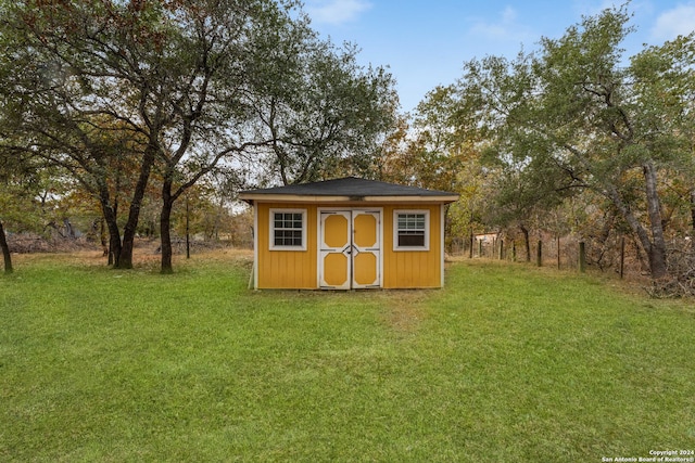 view of outdoor structure with a yard