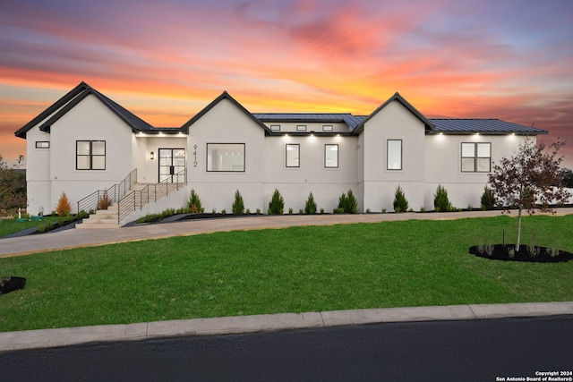 view of front of property with a yard