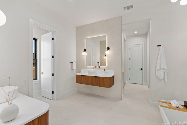 bathroom featuring tile patterned flooring and vanity