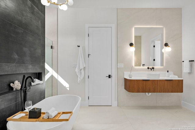 bathroom with tile patterned floors, vanity, and a tub