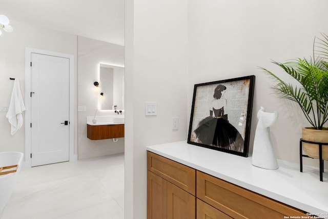 interior space with tile patterned flooring and vanity