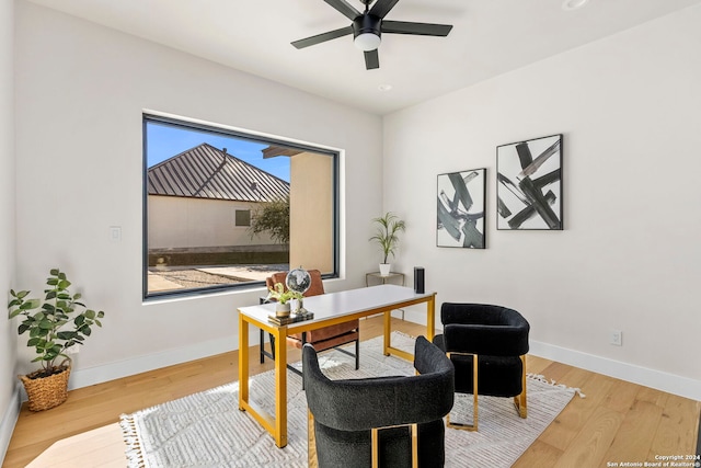 office with hardwood / wood-style floors and ceiling fan