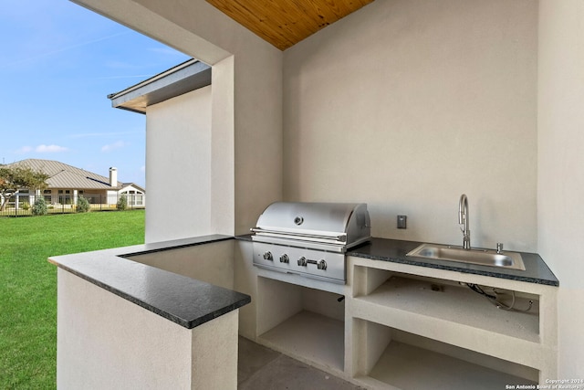 view of patio with a grill, exterior kitchen, and sink