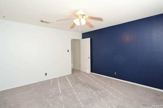 carpeted empty room with ceiling fan