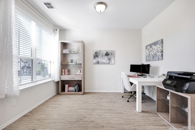 office space with light hardwood / wood-style floors