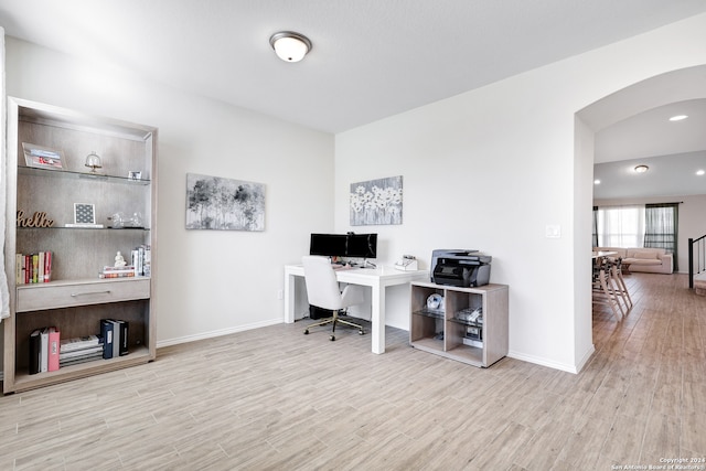 office space with light hardwood / wood-style floors