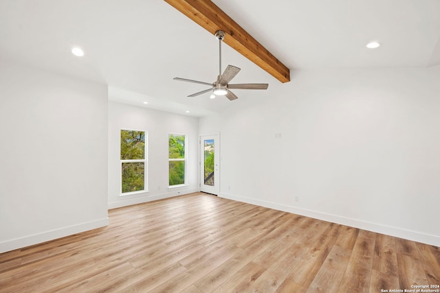 spare room with vaulted ceiling with beams, light hardwood / wood-style floors, and ceiling fan