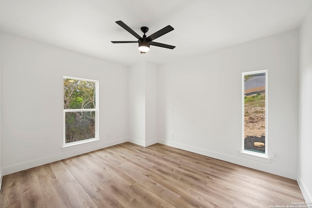 unfurnished room featuring ceiling fan and light hardwood / wood-style floors