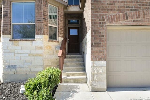 property entrance with a garage