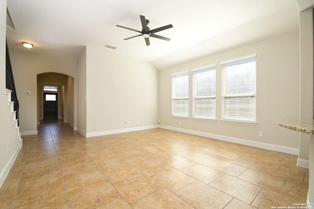 spare room with vaulted ceiling and ceiling fan