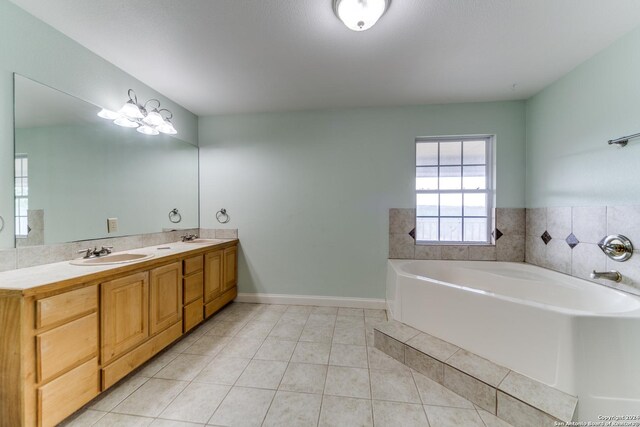34970AND34900 Smithson Valley Rd, Bulverde, TX 78163 - full bath featuring tile patterned flooring, a bath, baseboards, and double vanity