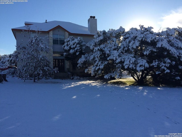 34970AND34900 Smithson Valley Rd, Bulverde, TX 78163 - snow covered property with a chimney