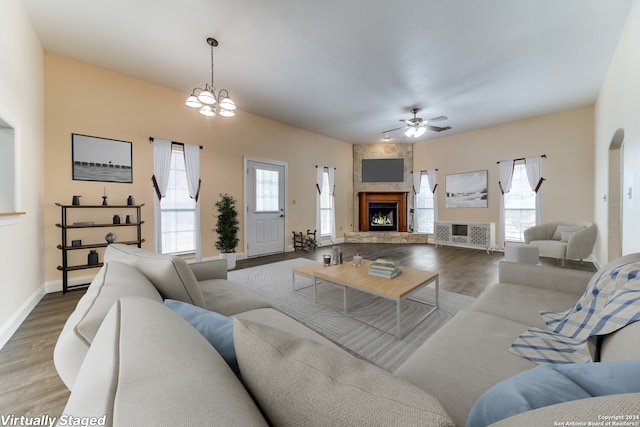 34970AND34900 Smithson Valley Rd, Bulverde, TX 78163 - living area featuring a fireplace, ceiling fan, wood finished floors, and baseboards