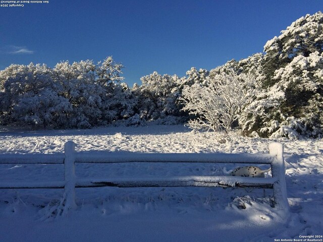34970AND34900 Smithson Valley Rd, Bulverde, TX 78163 - snowy yard featuring fence