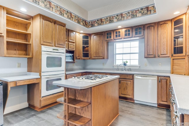 34970AND34900 Smithson Valley Rd, Bulverde, TX 78163 - kitchen with white appliances, a sink, open shelves, light wood-type flooring, and light countertops