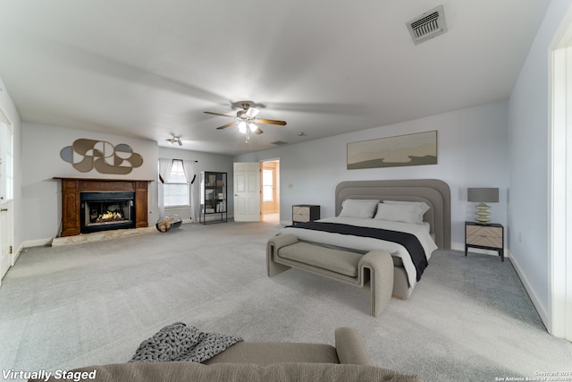 34970AND34900 Smithson Valley Rd, Bulverde, TX 78163 - bedroom featuring carpet flooring, baseboards, a glass covered fireplace, and ceiling fan