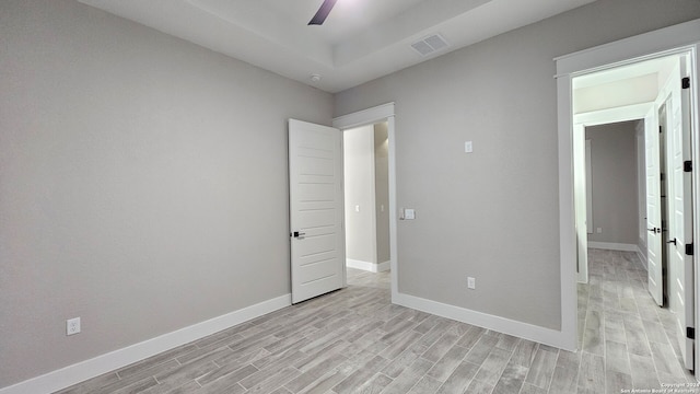 unfurnished bedroom featuring ceiling fan and light wood-type flooring