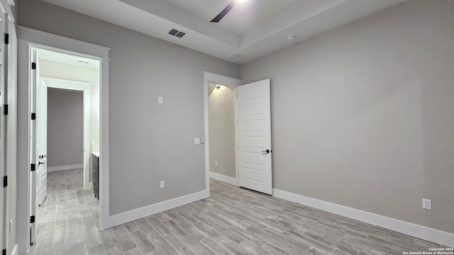 unfurnished bedroom with light wood-type flooring and ceiling fan