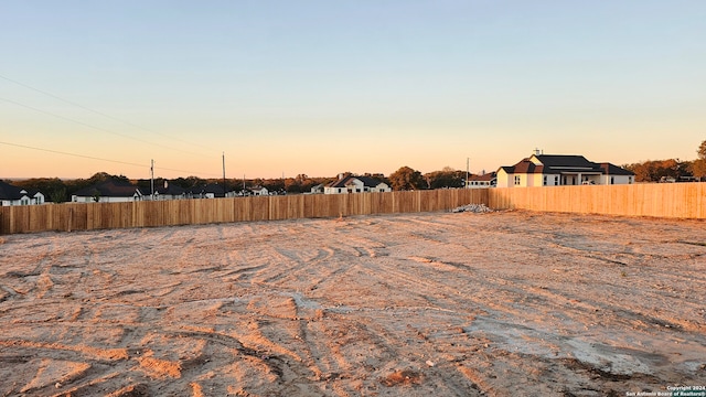 view of yard at dusk