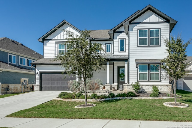 craftsman-style home featuring a garage and a front yard