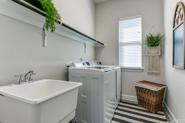 laundry room featuring sink and washing machine and clothes dryer