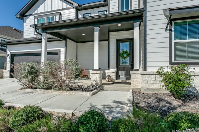 view of exterior entry featuring a porch