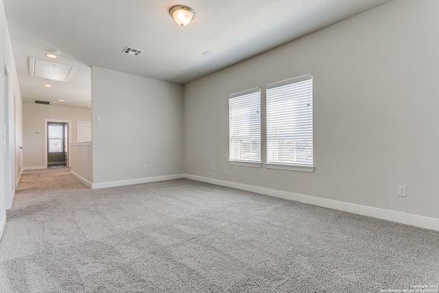 empty room featuring light colored carpet