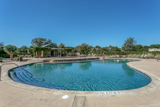 view of pool featuring a patio area