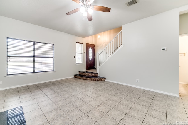 tiled entryway with ceiling fan