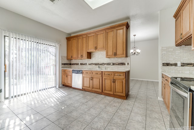 kitchen featuring stainless steel appliances, hanging light fixtures, a chandelier, light tile patterned floors, and tasteful backsplash