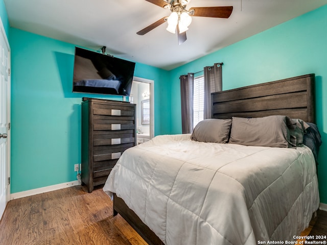 bedroom featuring ensuite bathroom, wood-type flooring, and ceiling fan