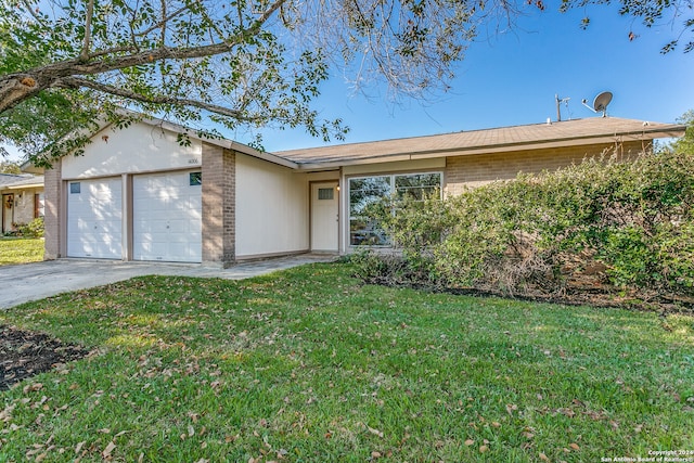 ranch-style house with a front lawn and a garage