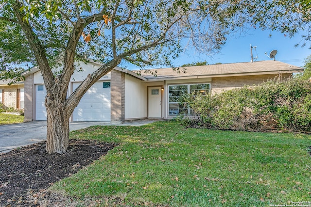 ranch-style house with a garage and a front lawn