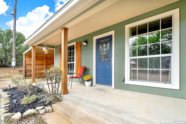 property entrance featuring covered porch