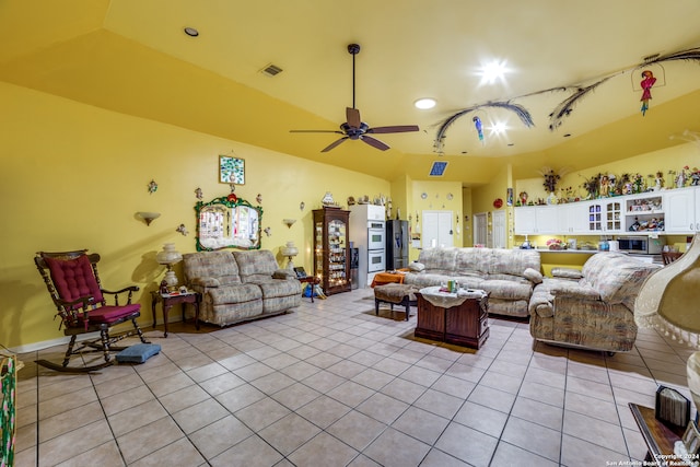 tiled living room featuring ceiling fan and lofted ceiling