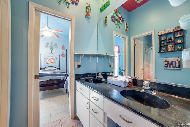 bathroom with ceiling fan, vanity, and tile patterned floors