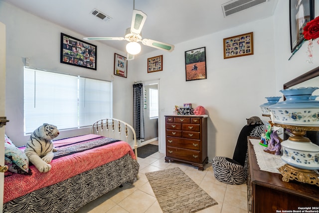 tiled bedroom with ceiling fan