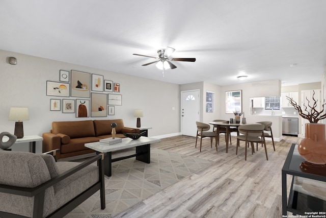 living room featuring ceiling fan and light wood-type flooring