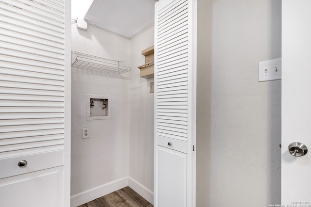 laundry room with washer hookup and hardwood / wood-style flooring